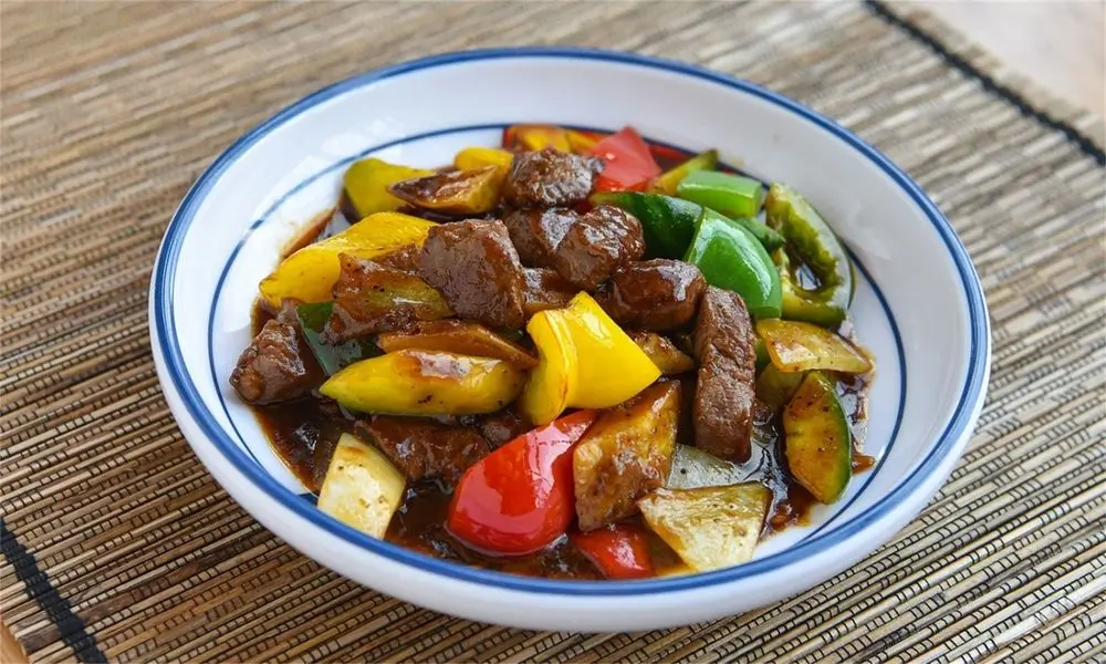 AURA-Restaurant-Asian-Restaurant-Stir-Fried-Beef-with-Bell-Peppers-Santa-Barbara Tender beef stir-fried with colorful bell peppers at AURA-Restaurant, a Asian Restaurant in Santa Barbara.